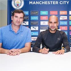 Guardiola signs new City contract
